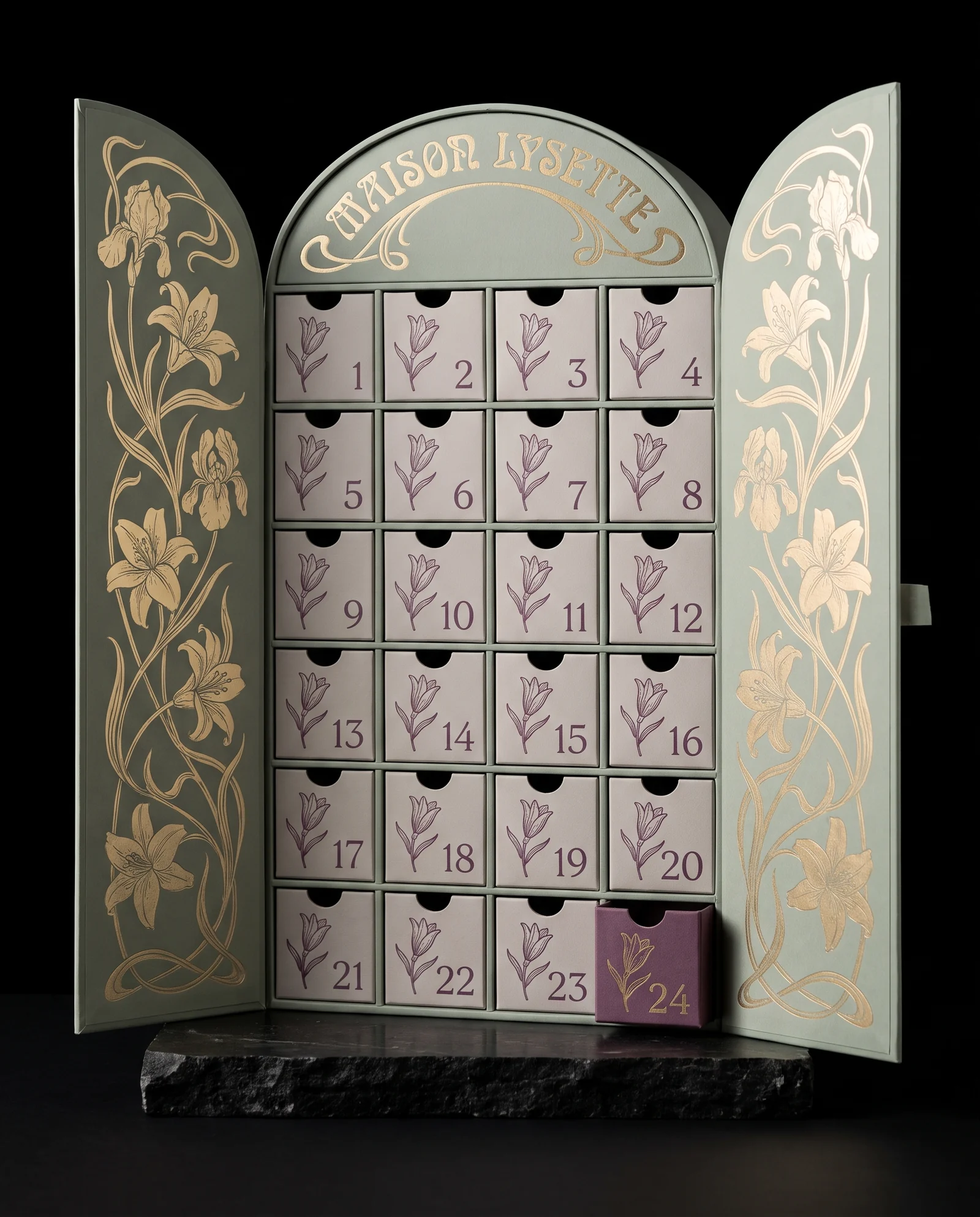 A sage green advent calendar shaped like an arched doorway, its two arched doors open and covered in matte gold lily and iris stems, MAISON LYSETTE in curved gold lettering on the crown, and 24 pale grey drawers with plum lily buds and numerals.