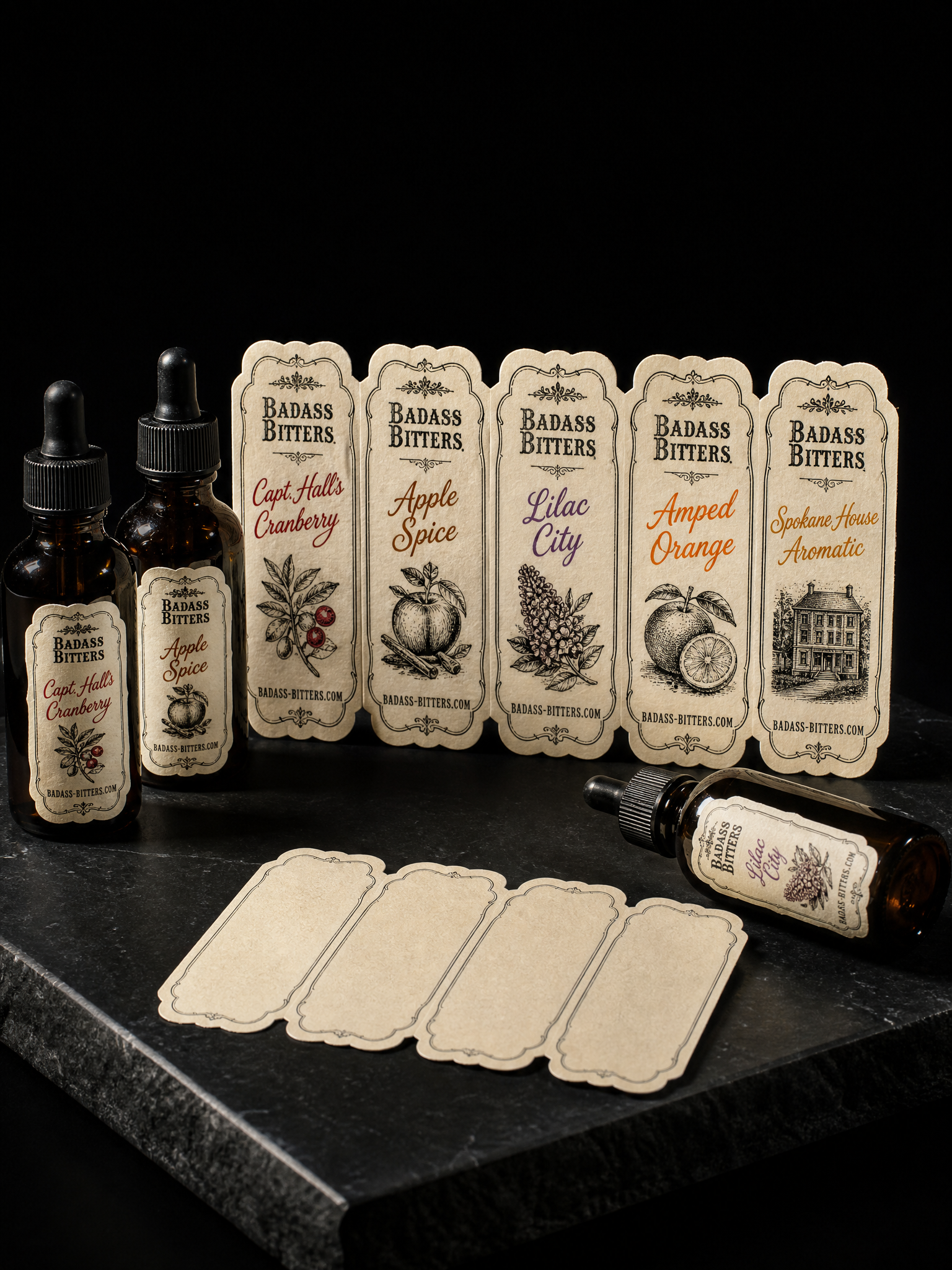 Labels for Badass Bitters with 60# uncoated cream label stock, 2-colour letterpress, 5 pantone accents and scalloped kiss-cut.