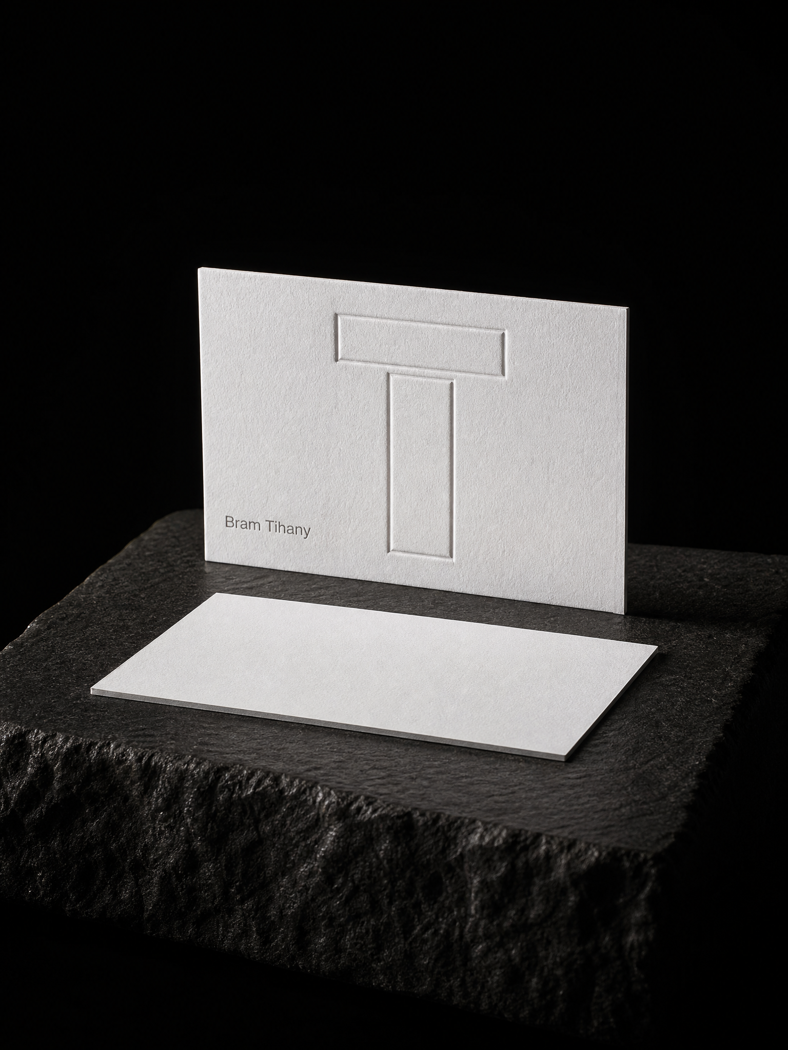 Business-cards for Bram Tihany with 48pt triple-thick white cotton, multi-level blind emboss and grey letterpress.