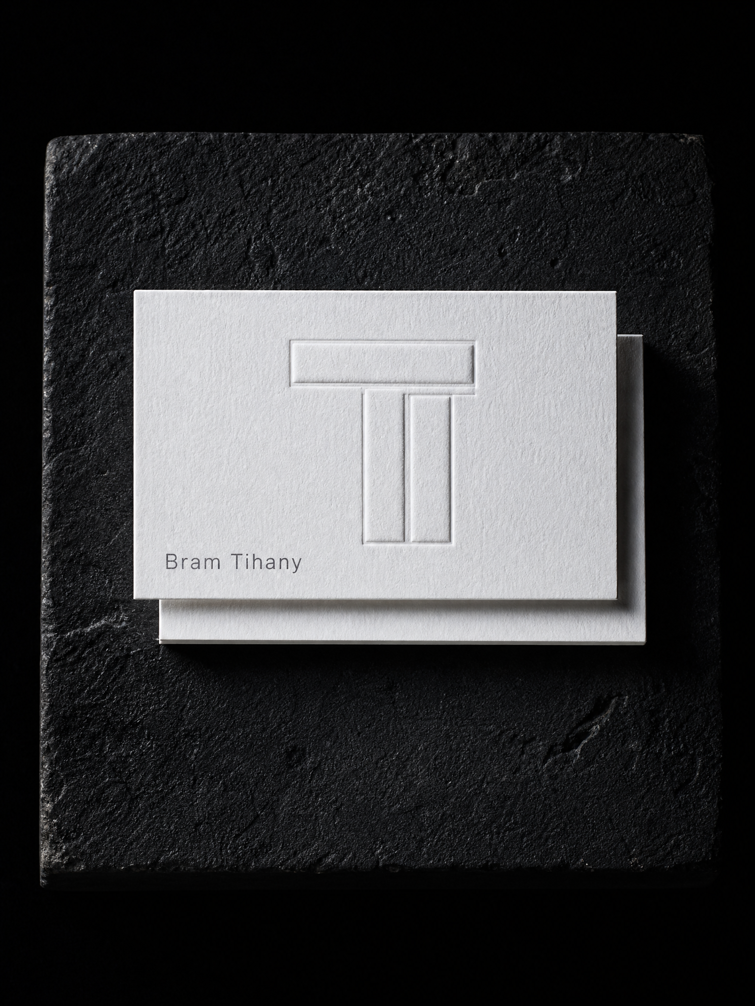 Bram Tihany business cards — 48pt triple-thick white cotton, Multi-level blind emboss, Grey letterpress