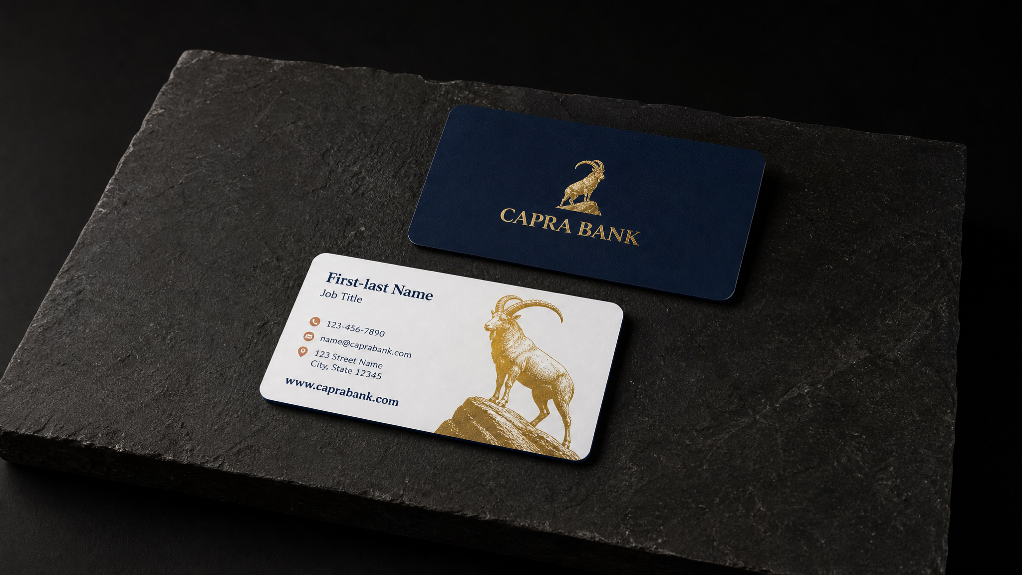 The finished Capra Bank business cards shown in full — 3.375 × 2.125 in, rounded corners, 32pt soft-touch matte, Gold hot foil, both sides, PMS 654 C + PMS 728 C spot, Painted edge, PMS 654 C.