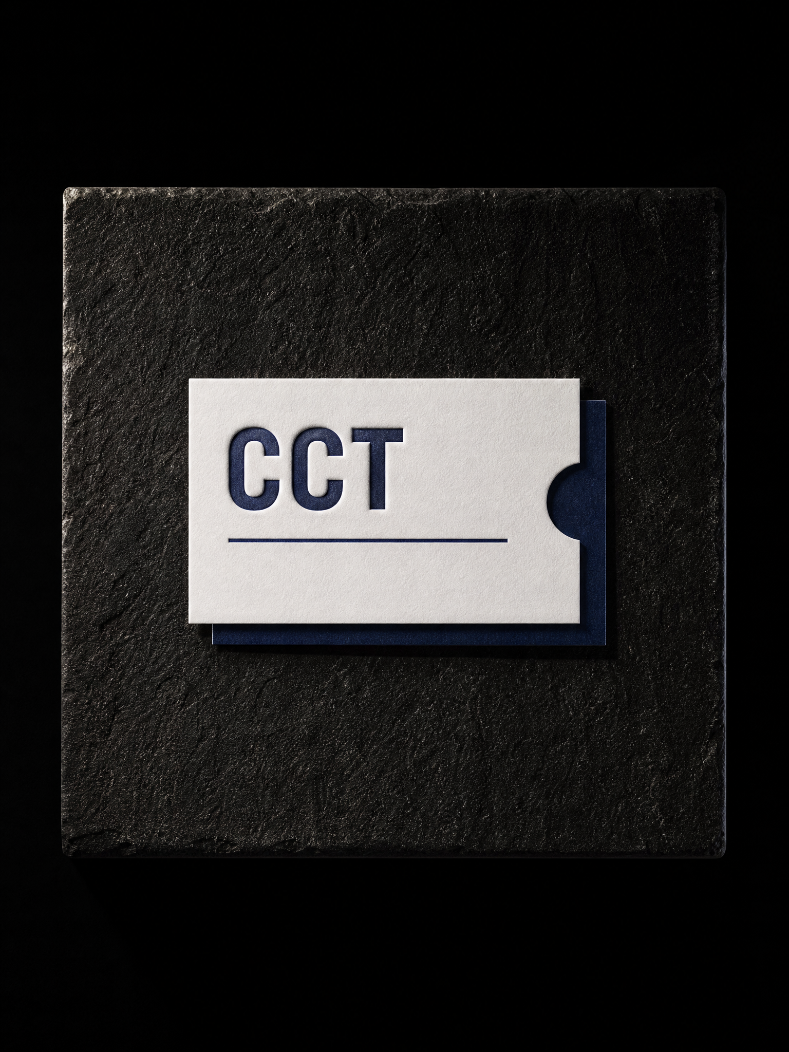 CCT business cards — 32pt white cotton, Navy letterpress, Custom die-cut notch