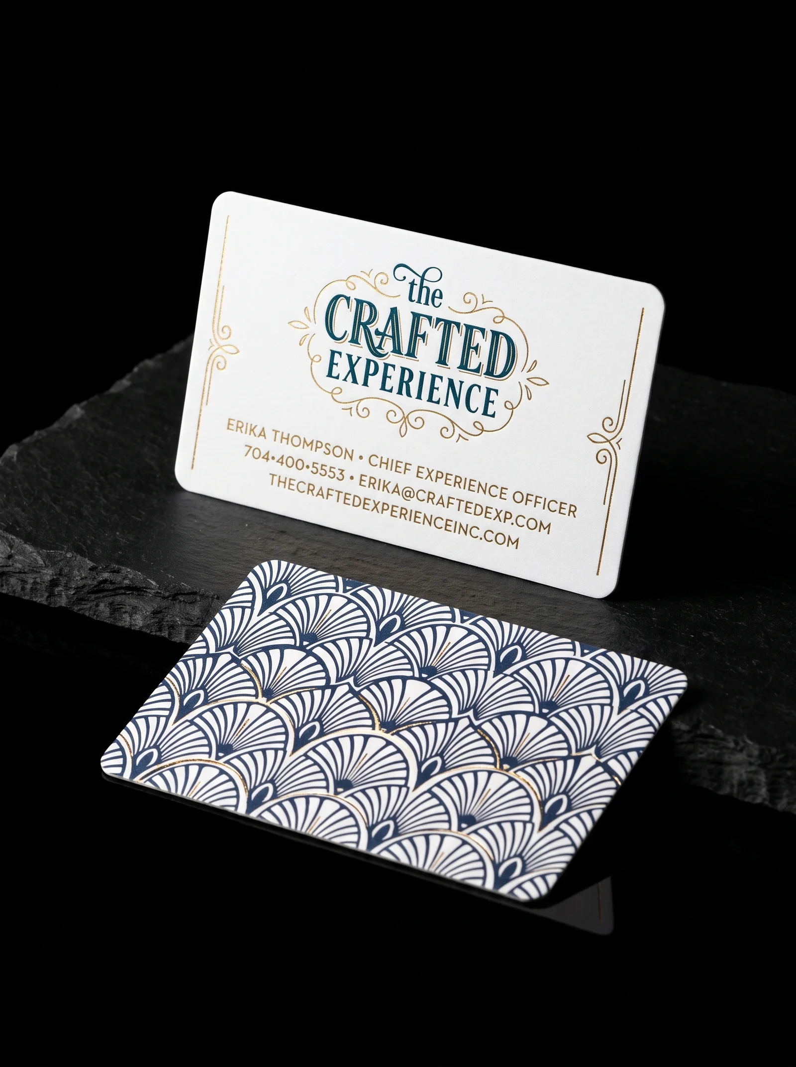 The Crafted Experience white die-cut card with navy art-deco pattern back and gold foil flourishes