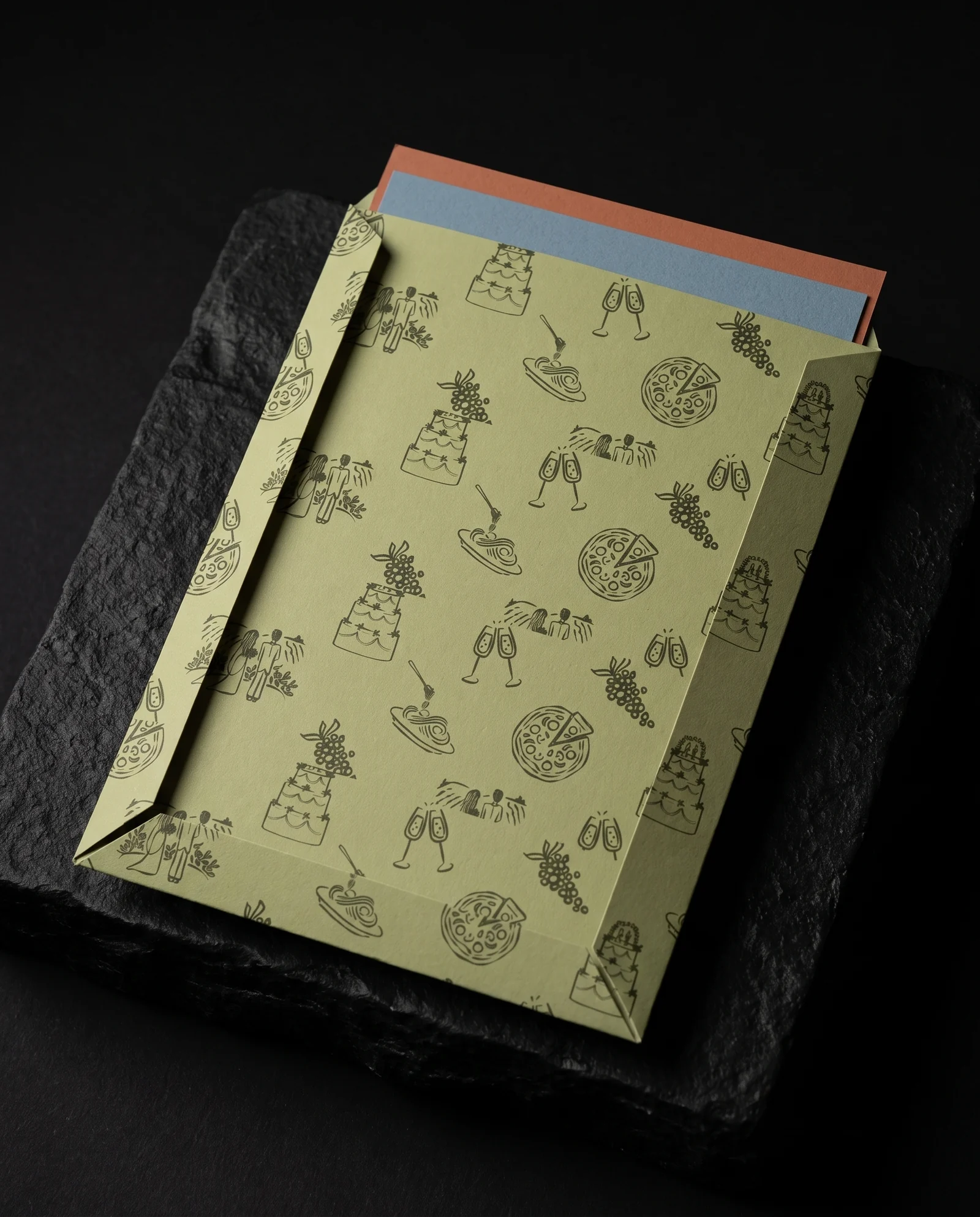 Back of sage invitation pocket with edge-to-edge doodles from the couple's designer, simulated before press