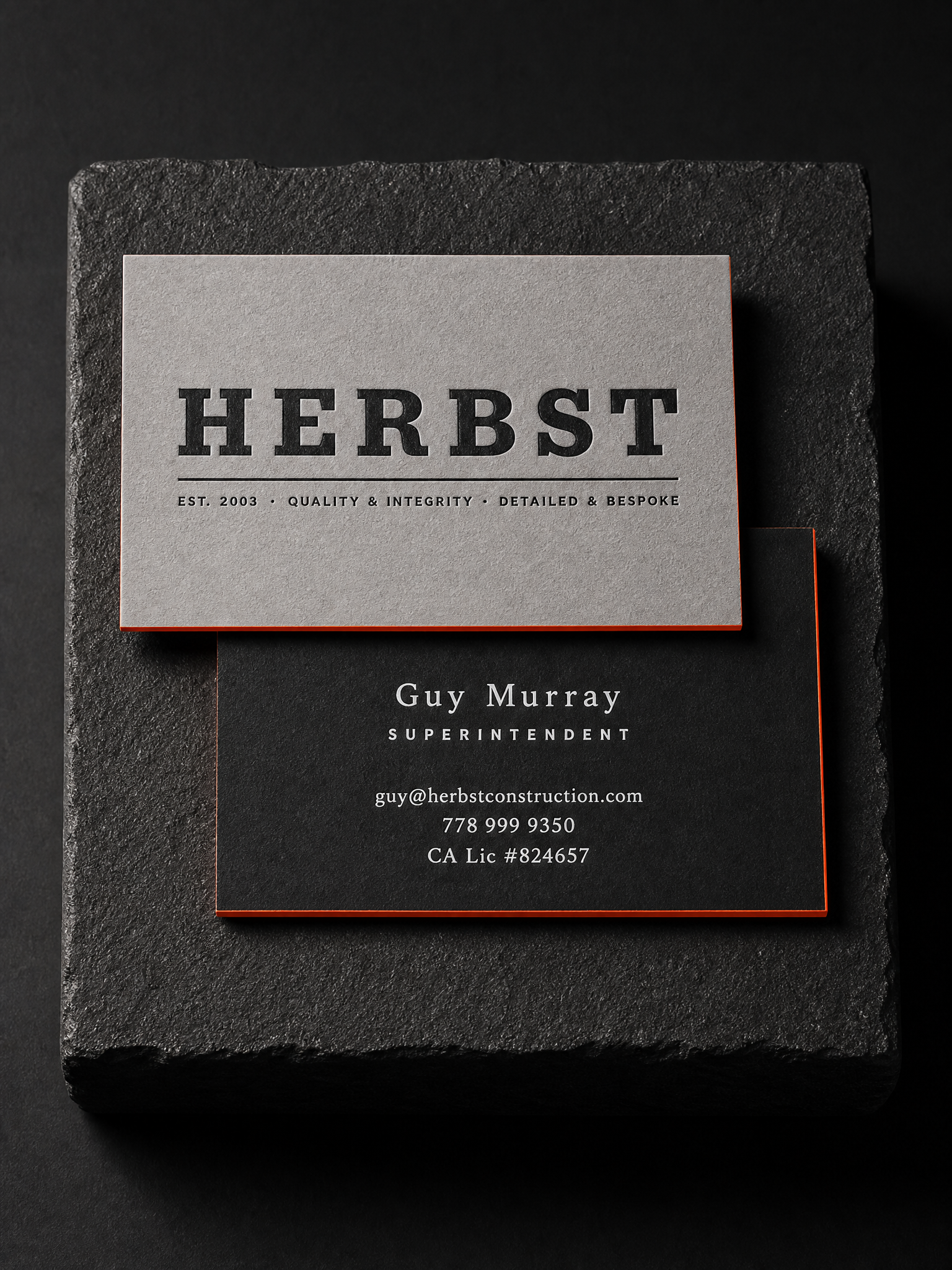 Herbst Construction business cards: 32pt duplex, grey / black, black letterpress, white foil