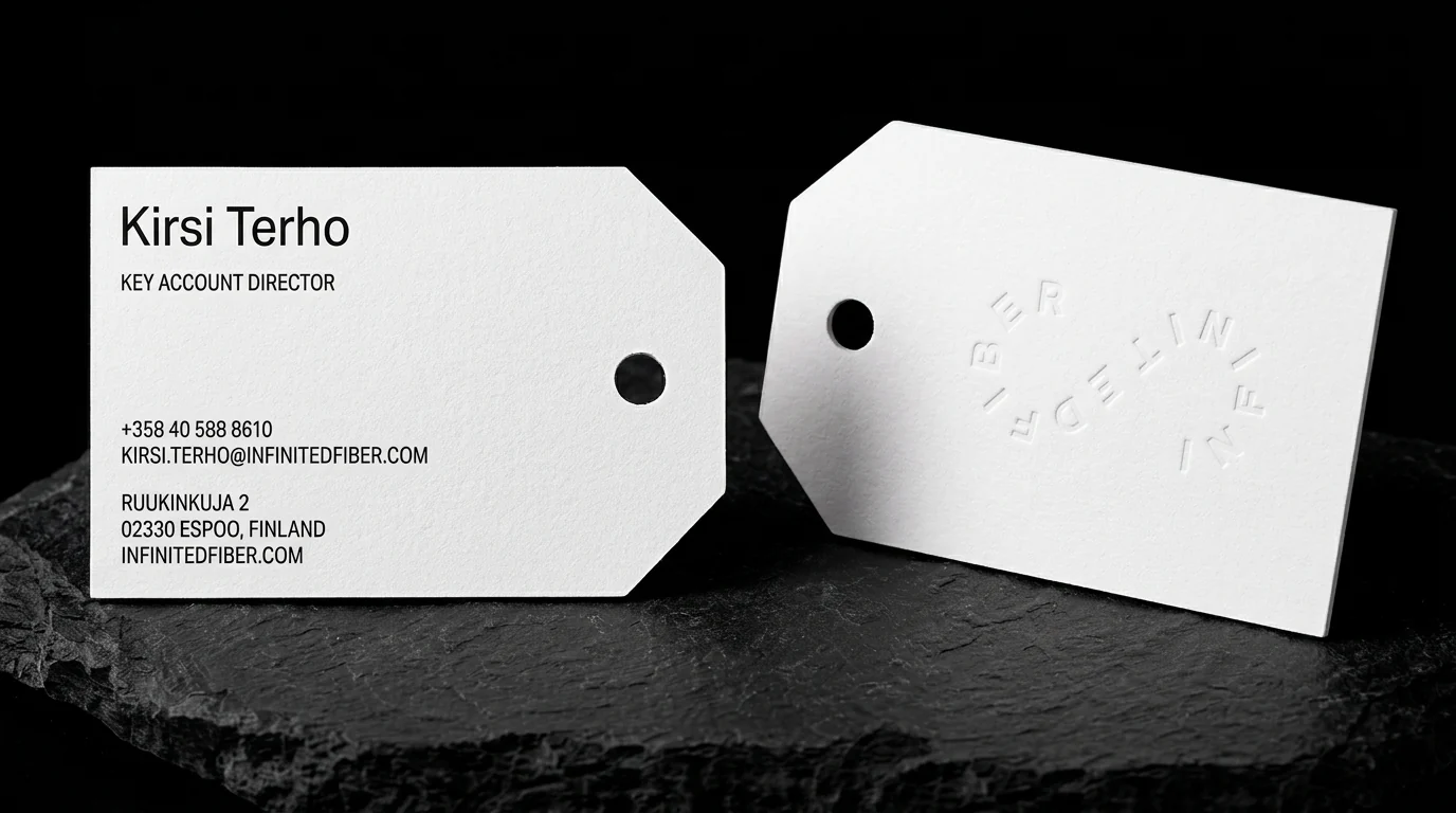 Business-cards for Infinited Fiber with 100% recycled cotton, triplex construction, custom die-cut, punched hole, blind emboss and black ink.