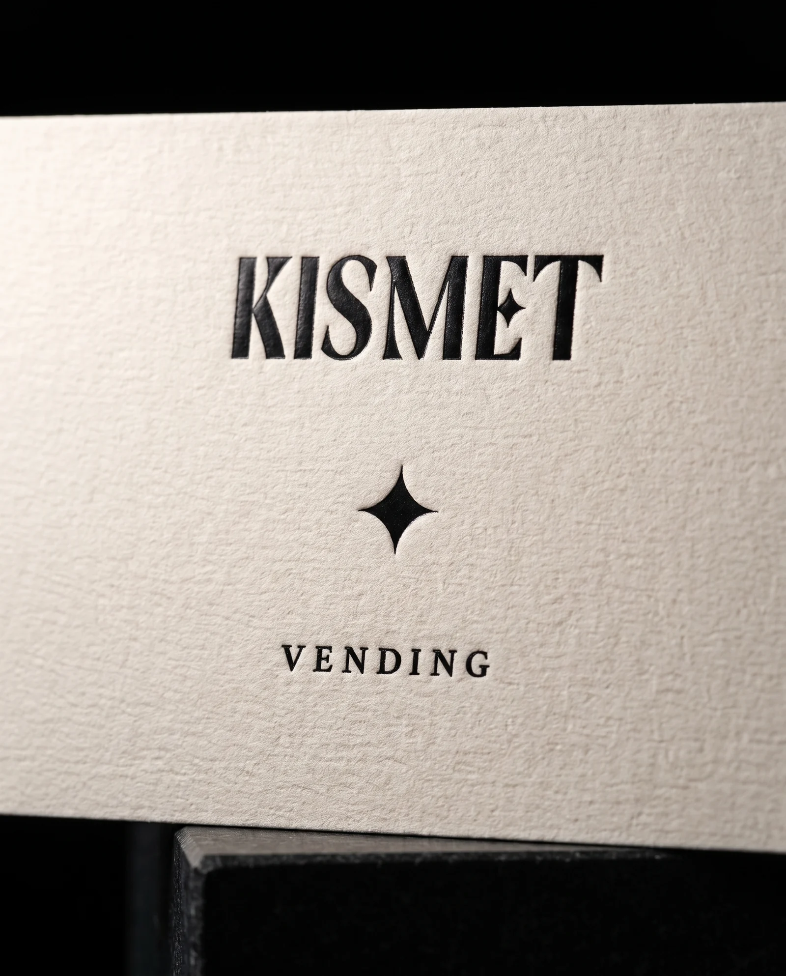 Black foil + deboss: a soft sheen, pressed in