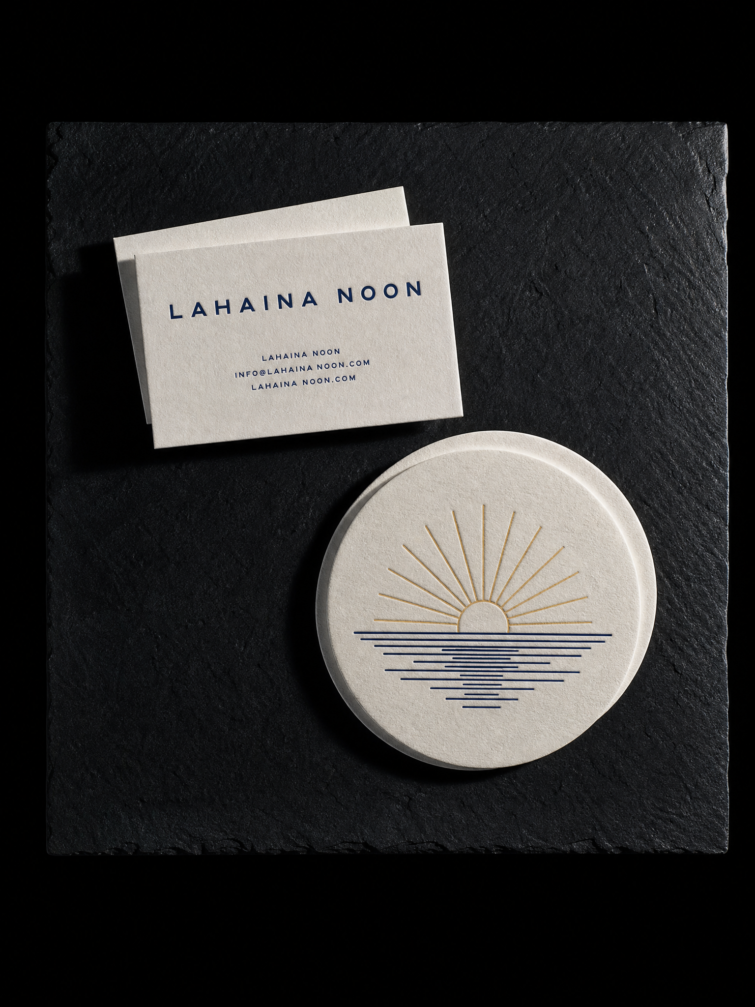Lahaina Noon business cards — 32pt off-white cotton, Navy letterpress, Heavyweight coaster board, 4 in round