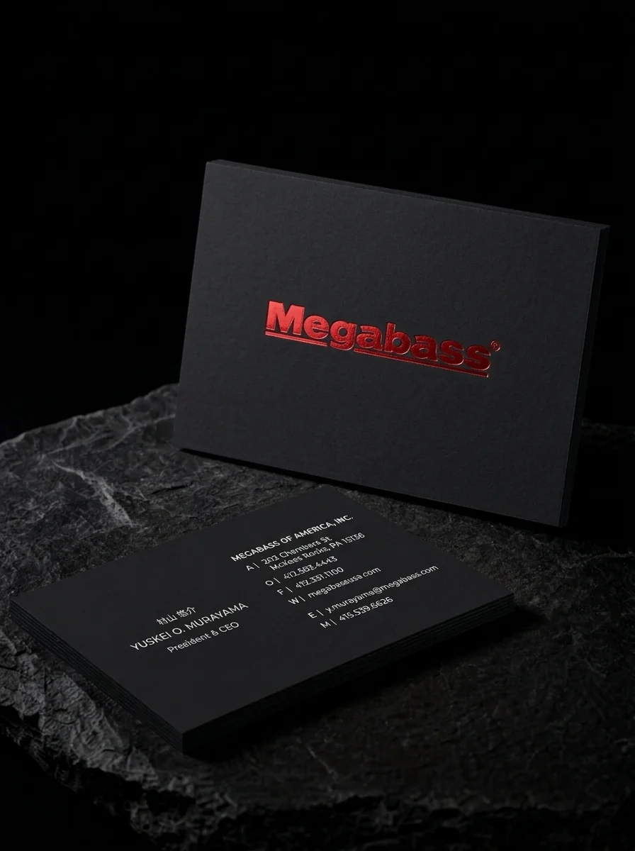 Business-cards for Megabass of America with red mark foil stamping, black card, pale reverse lettering and bilingual.
