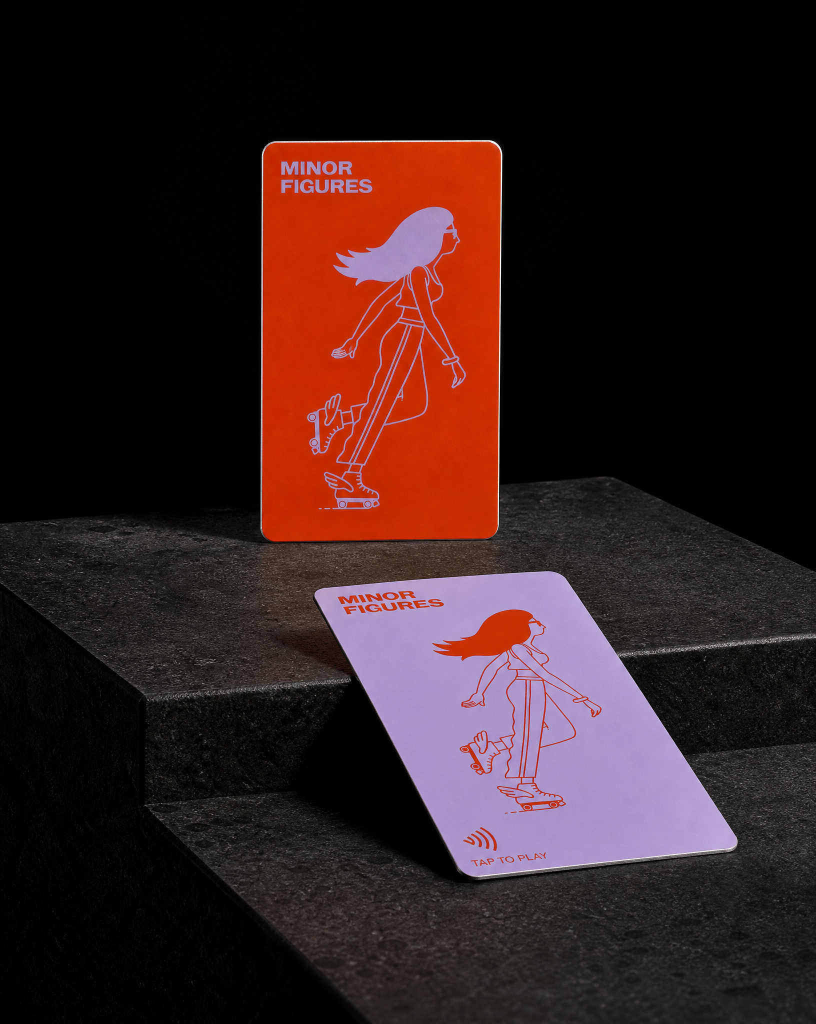 Inverted colourway: orange ground with lilac illustration on the hybrid metal and PVC card