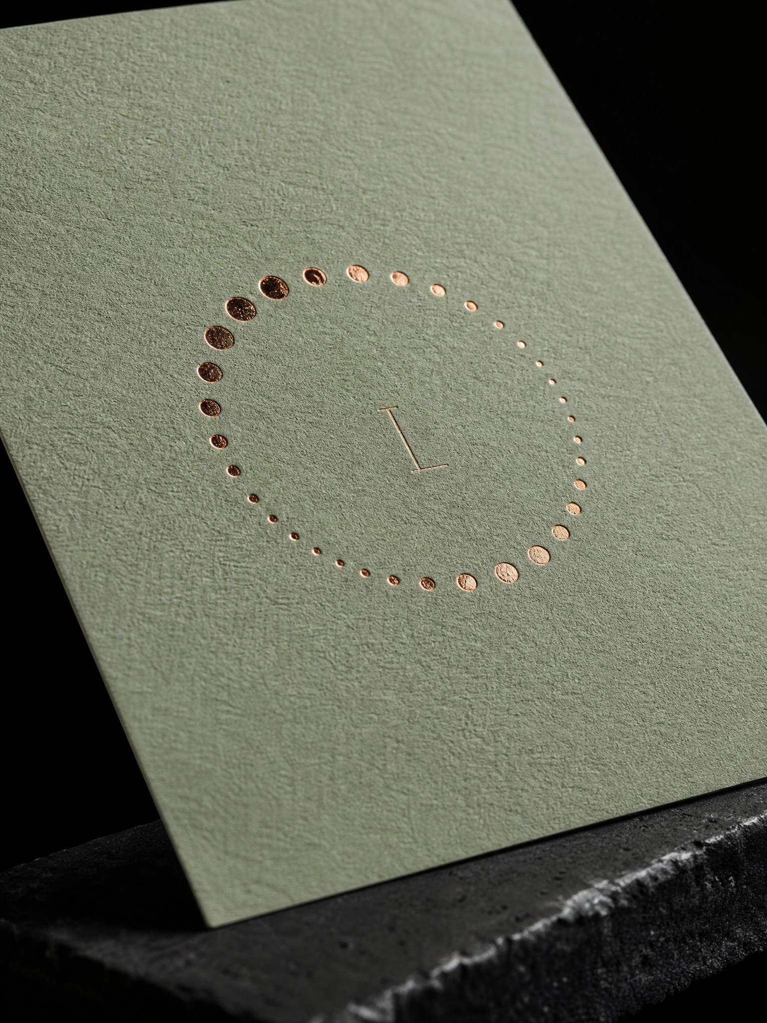Dotted ring monogram, copper on sage — macro, by Print Peppermint