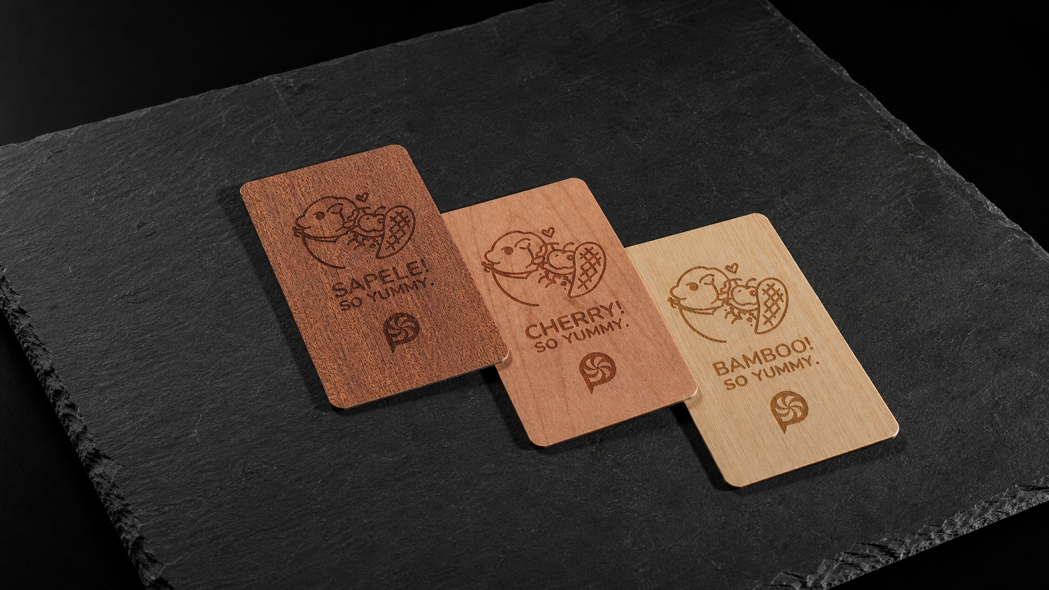 Sapele, cherry and bamboo wood business cards stepped to show the 0.6 mm sheet thickness