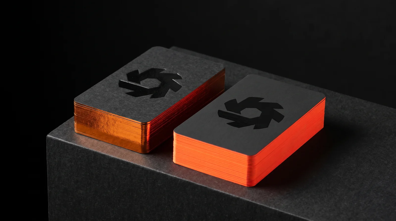 Both Soundtoys production directions side by side on a black plinth, the metallic orange edge on the left and the neon painted edge on the right. Production simulation.