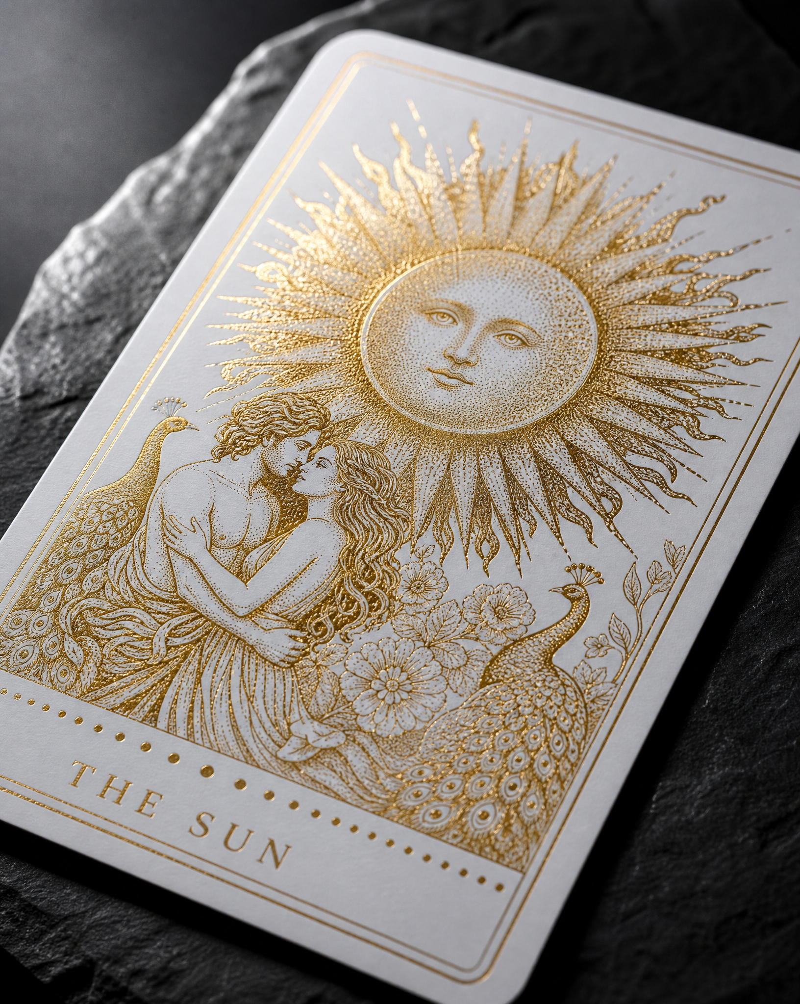 Close detail of the The Sun (independent tarot deck) stickers — 2.75 × 4.75 in, rounded corners, 16pt white silk, Gold hot foil, single pass, Minimum dot 0.25 mm.
