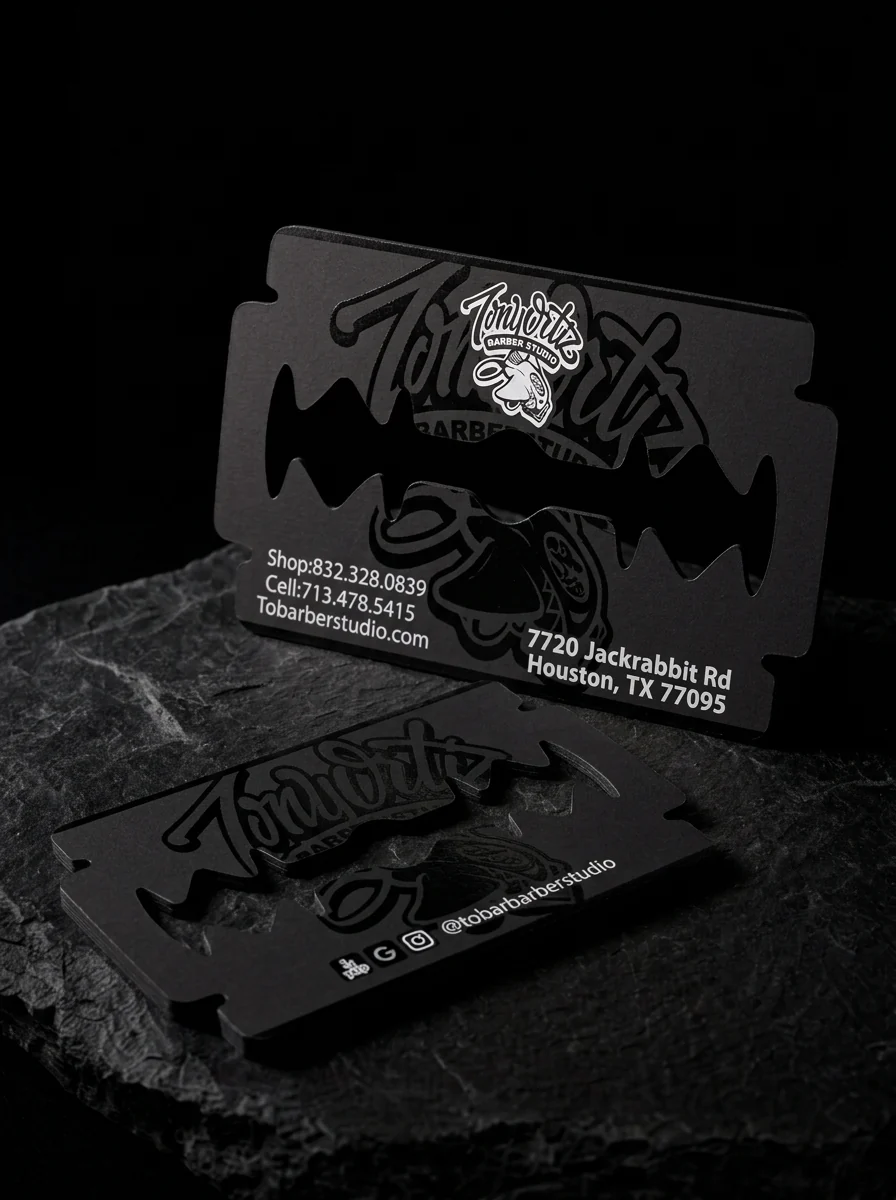 Tony Ortiz Barber Studio: a razor blade. Blade-shaped die with an open centre slot · matte black · tone-on-tone gloss logo