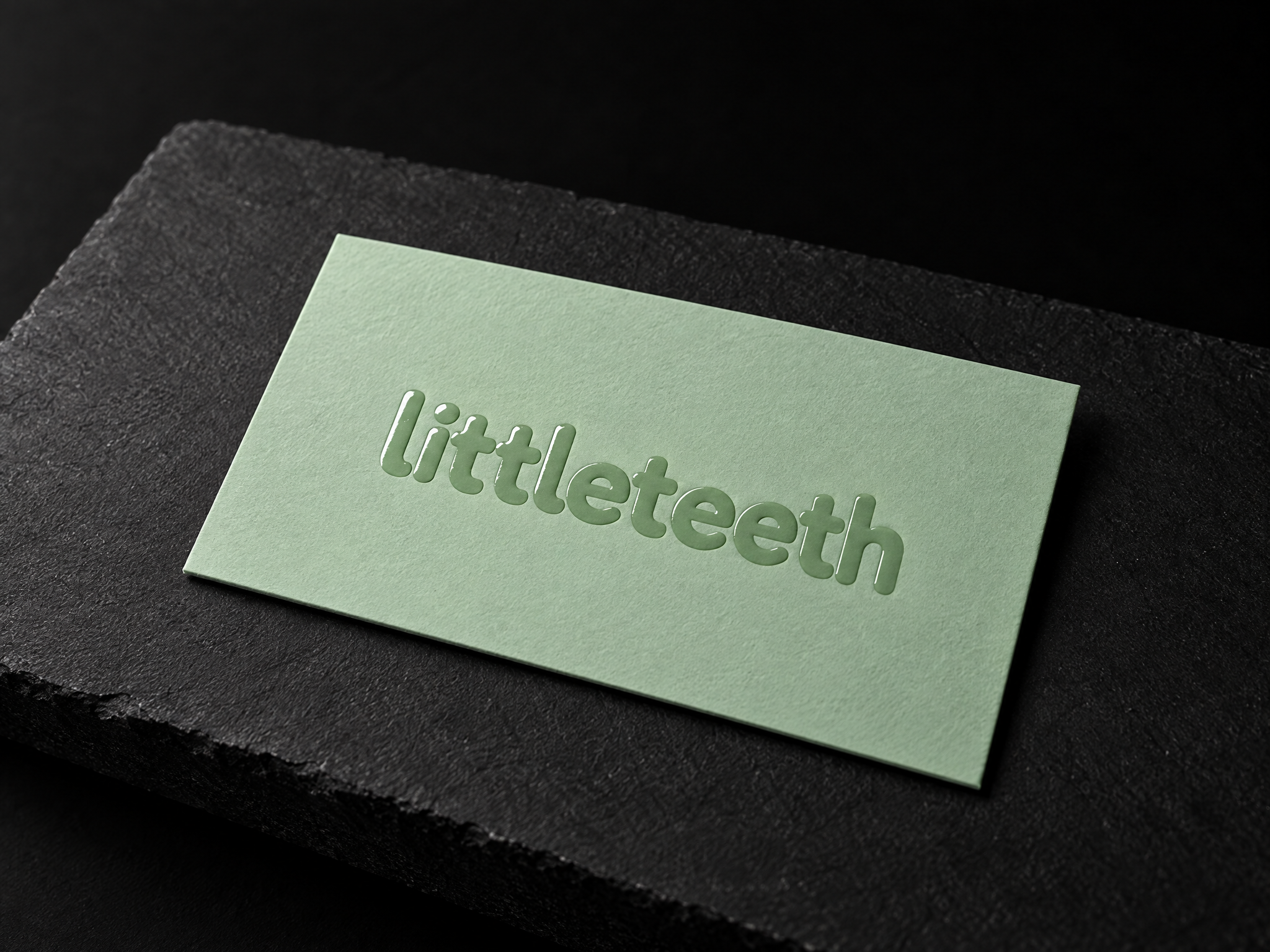 littleteeth pediatric dental identity, designed by Print Peppermint, debossed on a mint-green appointment card
