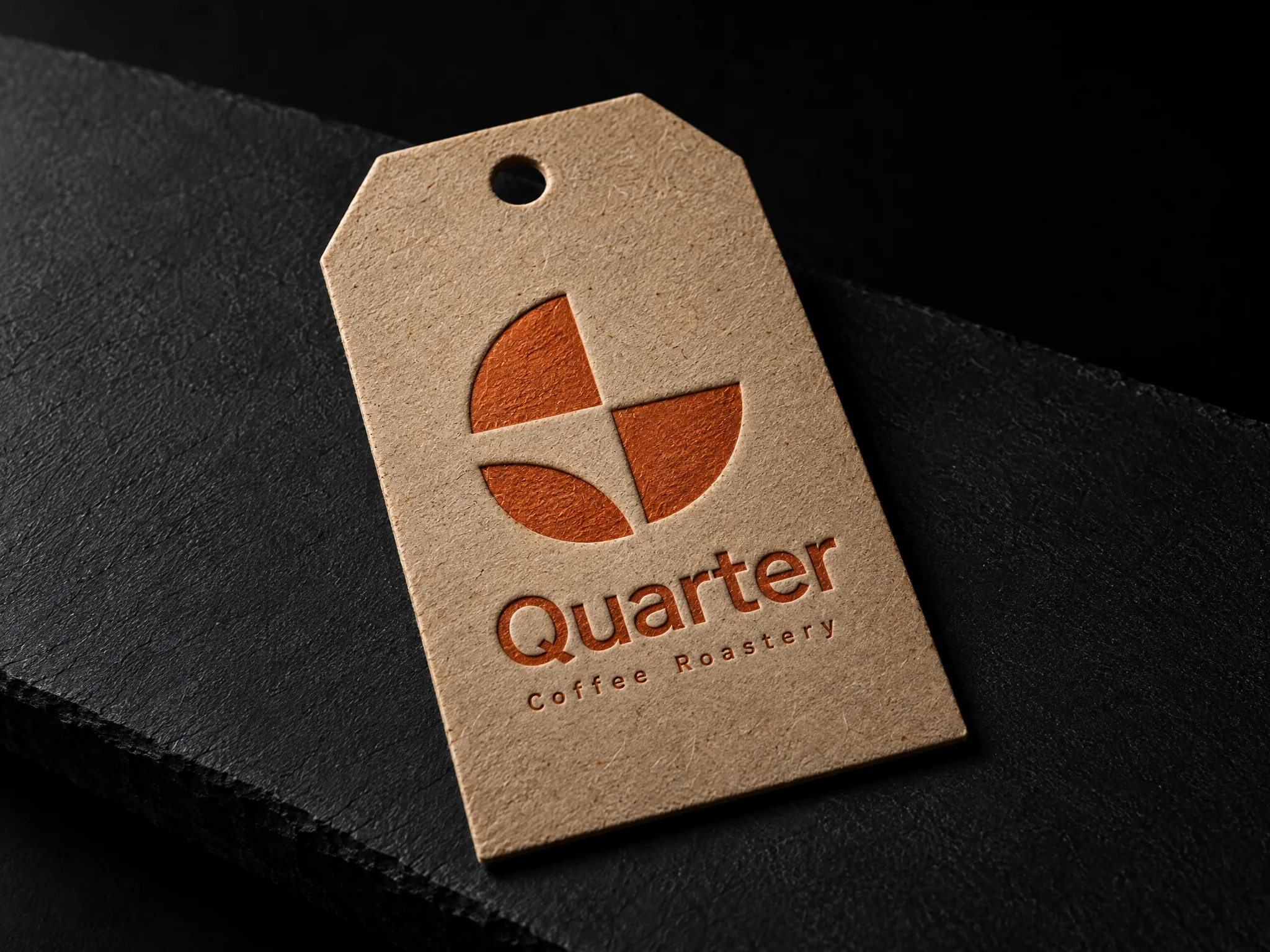 Quarter coffee roastery identity, designed by Print Peppermint, printed in orange on a kraft coffee-bag swing tag