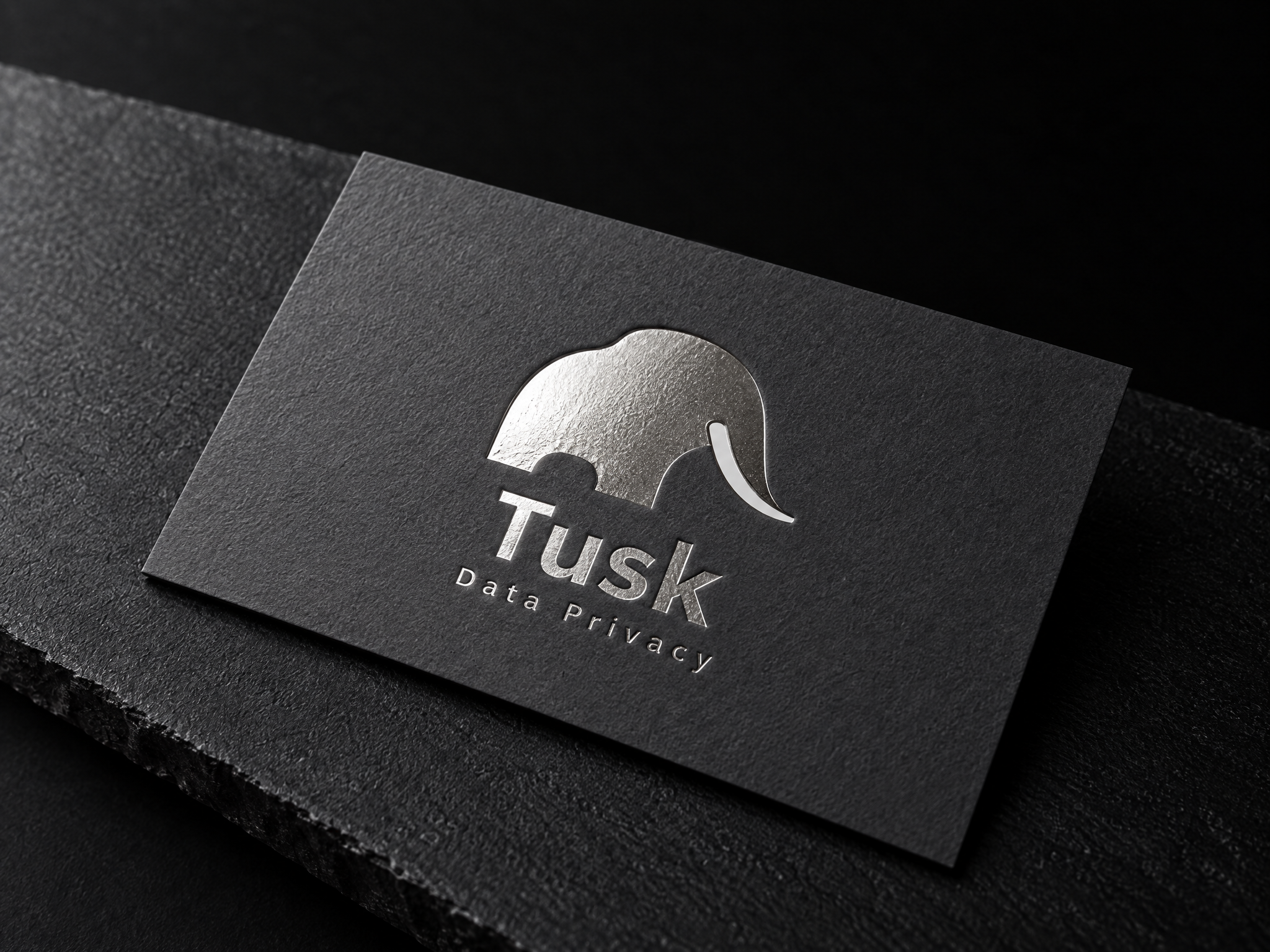 Tusk data privacy identity, designed by Print Peppermint, silver-foiled on a charcoal card