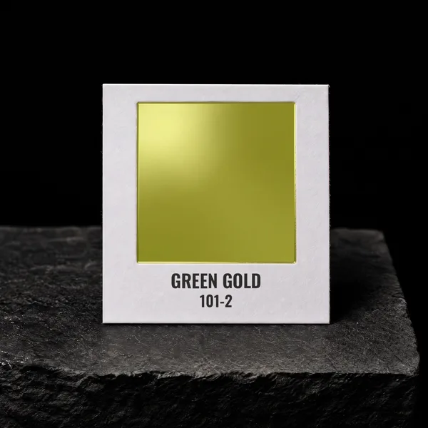 Green Gold 101-2 foil chip photographed on slate