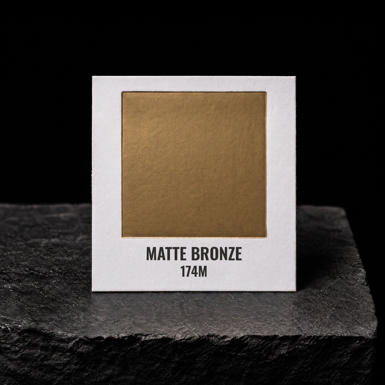 Matte Bronze 174M, real foil chip on slate