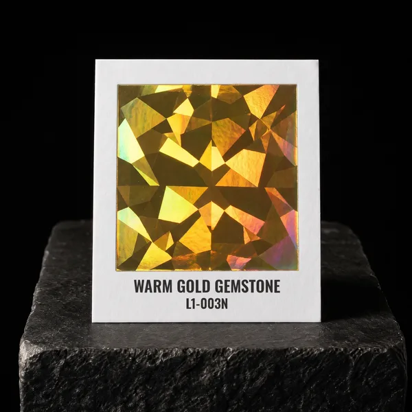 Warm Gold Gemstone L1-003N foil chip photographed on slate