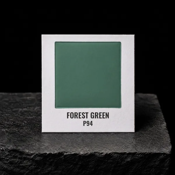 Forest Green P94 foil chip photographed on slate