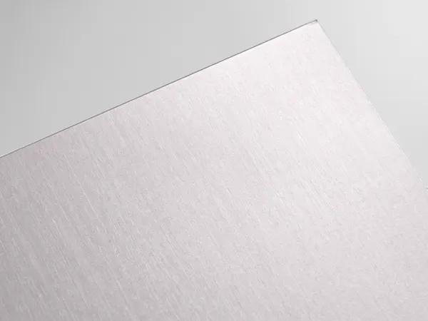 Gmund 925 White Silver paper swatch: White Silver, Silver metallic faces from brushed-aluminium smooth to coarse silver pigment; some two-sided
