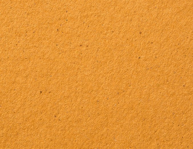 Gmund Bier Pils paper swatch — warm golden amber, flecked with darker grain
