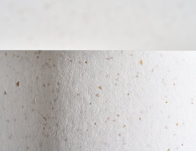 Gmund Bier Weizen paper swatch — soft wheat white with amber and rose grain fleck