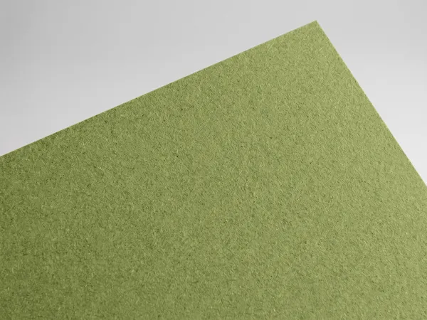 Gmund Les Naturals Olivine paper swatch: Olivine, Rough, toothy recycled board with natural multicoloured inclusions