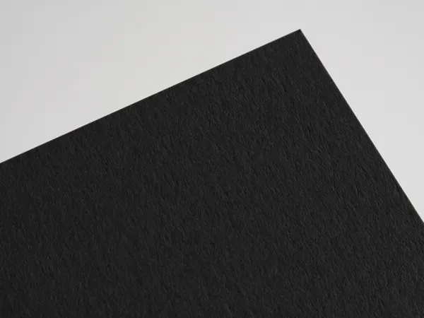 Sirio Color Rough Black paper swatch: Black, rough, high-bulk uncoated, pulp-dyed