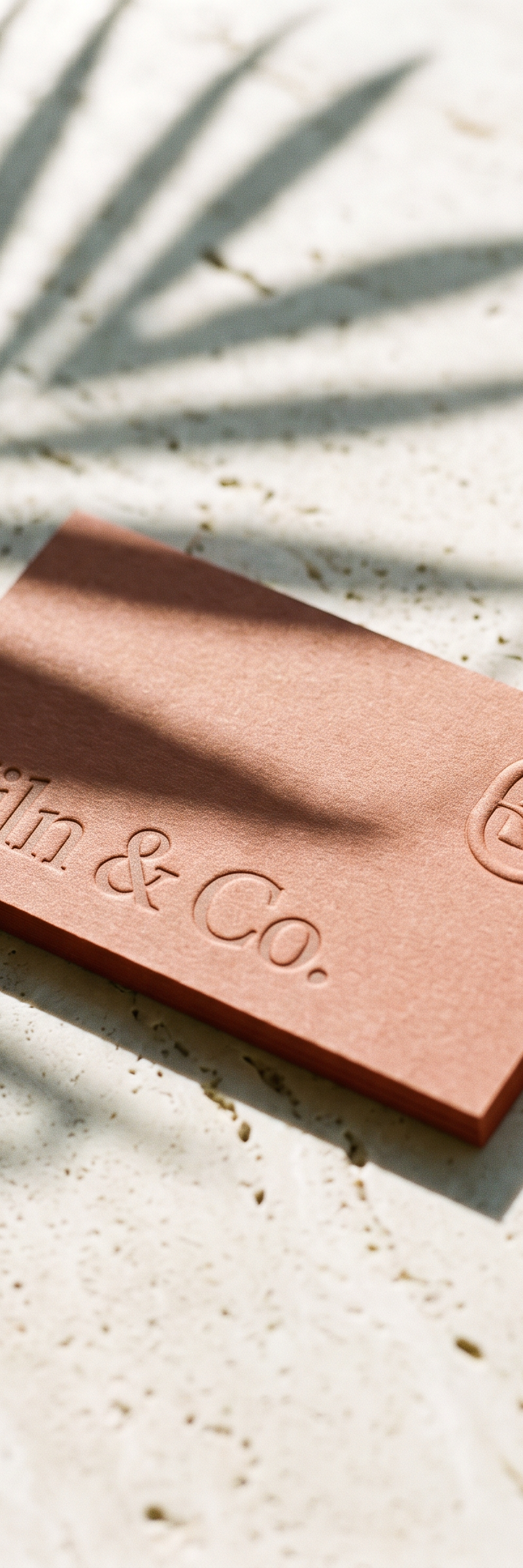 Business card with blind deboss, blind emboss and ink pantone on fedrigoni materica terra rossa stock.