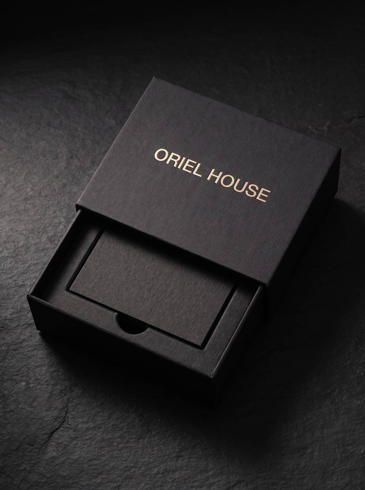 Rigid box concept: gmund gmund-colors-matt 10 · Ink Black · pale-gold foil · blind deboss