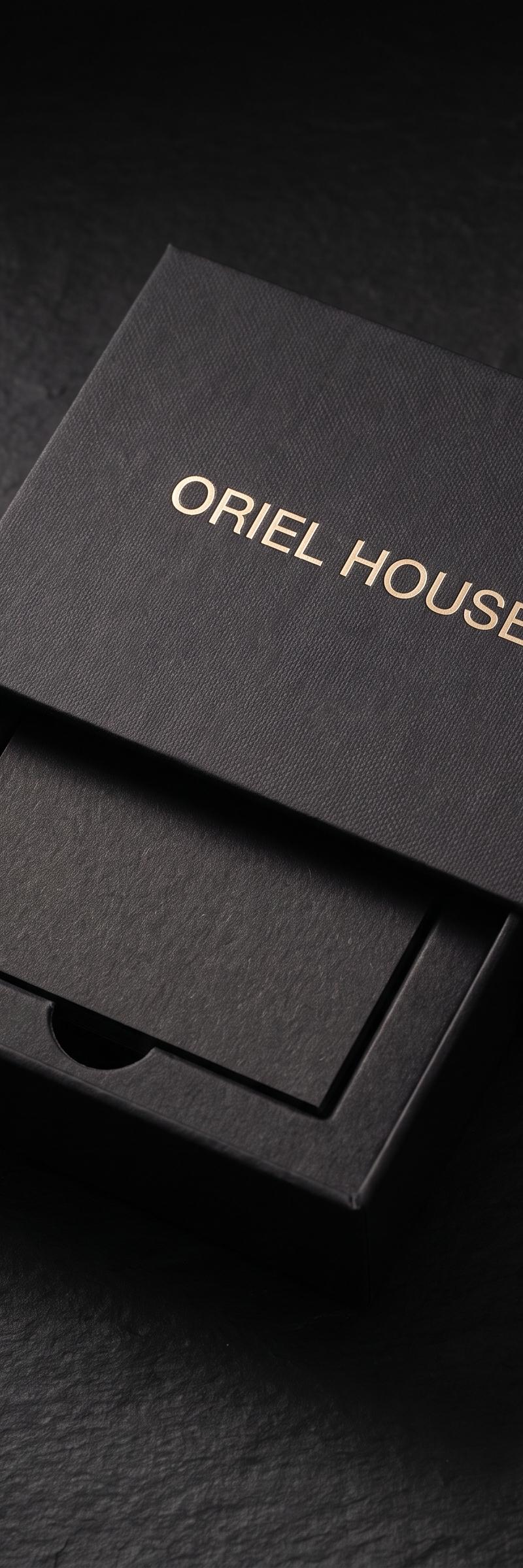 Merch with pale-gold foil stamping and blind deboss on gmund gmund-colors-matt 10 · ink black stock.