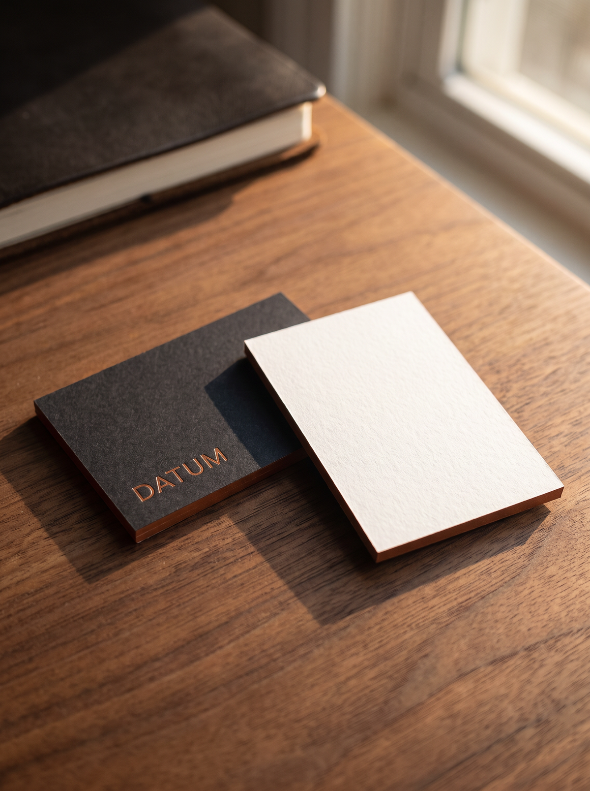 Business card concept: gmund gmund-colors-matt 10 · Ink Black · registered emboss · copper foil