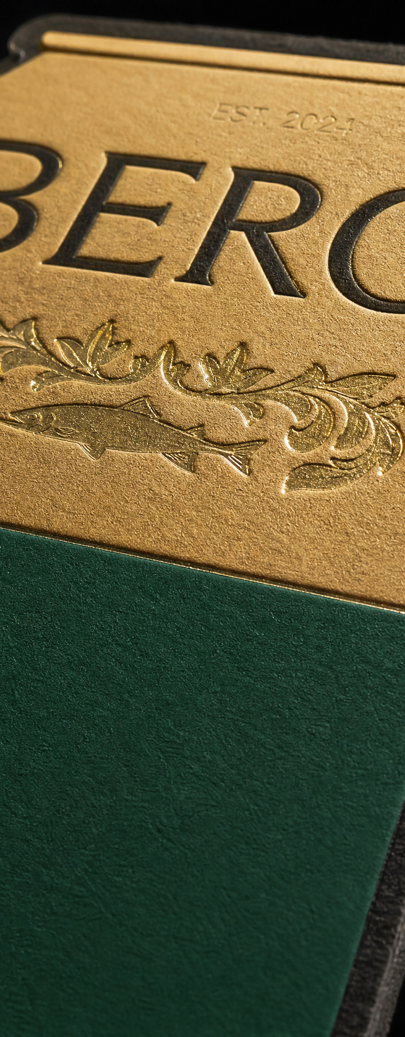 Business card with matte-gold-, green-pigment- and clear- foil stamping and die-cut.