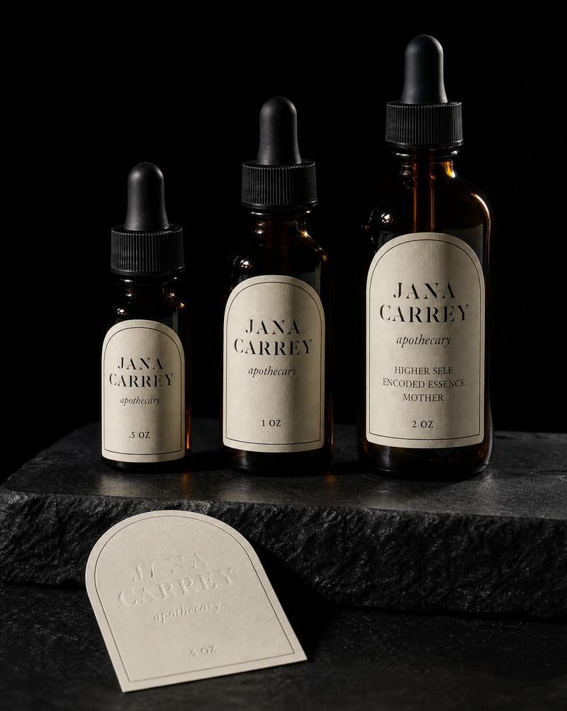 Arch-topped die-cut labels in three heights on amber dropper bottles.