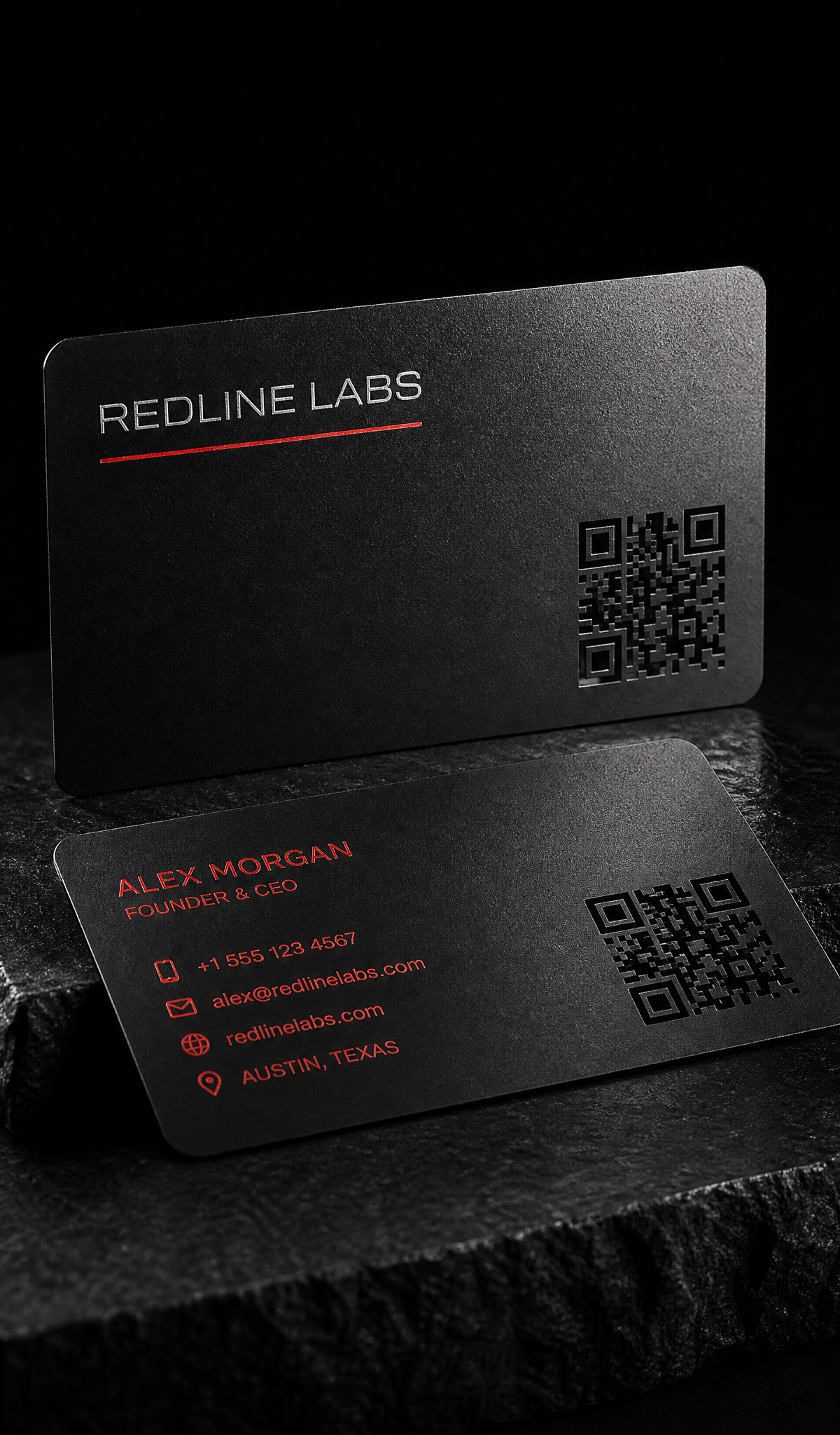 Frosted black metal card with a red enamel QR code cut through the steel