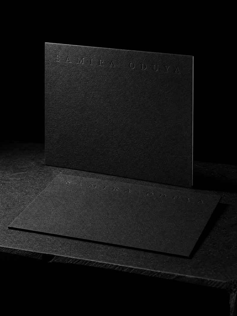 House sample: Blind letterpress caps on 32pt black uncoated: only the shadow reads.