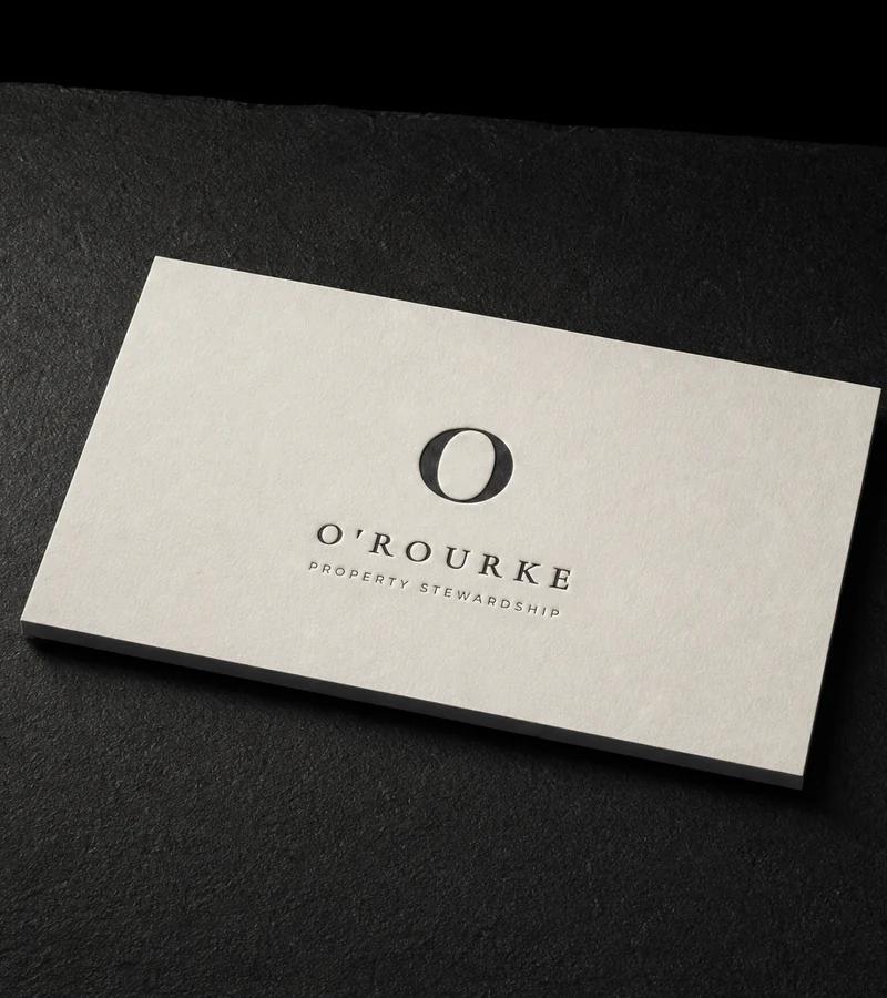 Duplex cotton business card with a single warm black letterpress ink on both sides