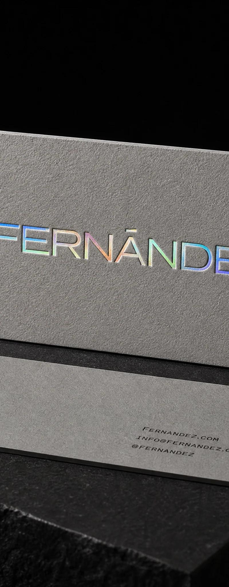 Business card with holographic- foil stamping and deboss.