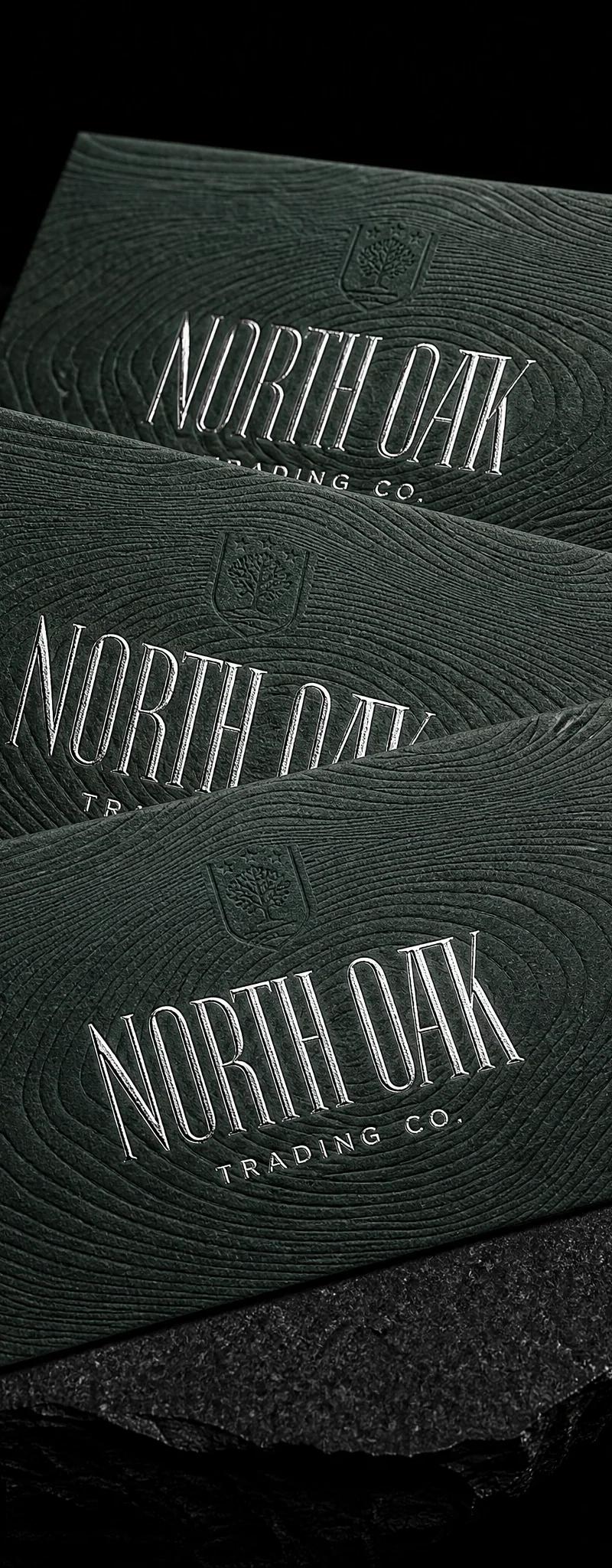 Business card with silver- foil stamping and emboss.