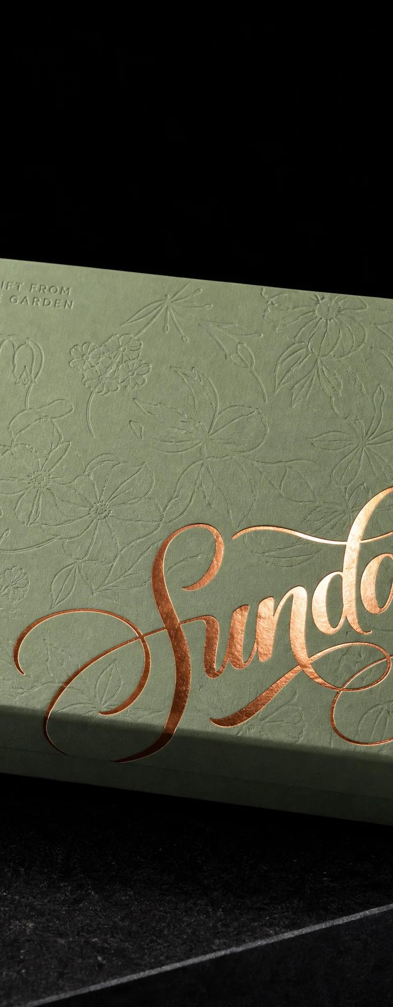 Business card with copper- foil stamping and emboss.