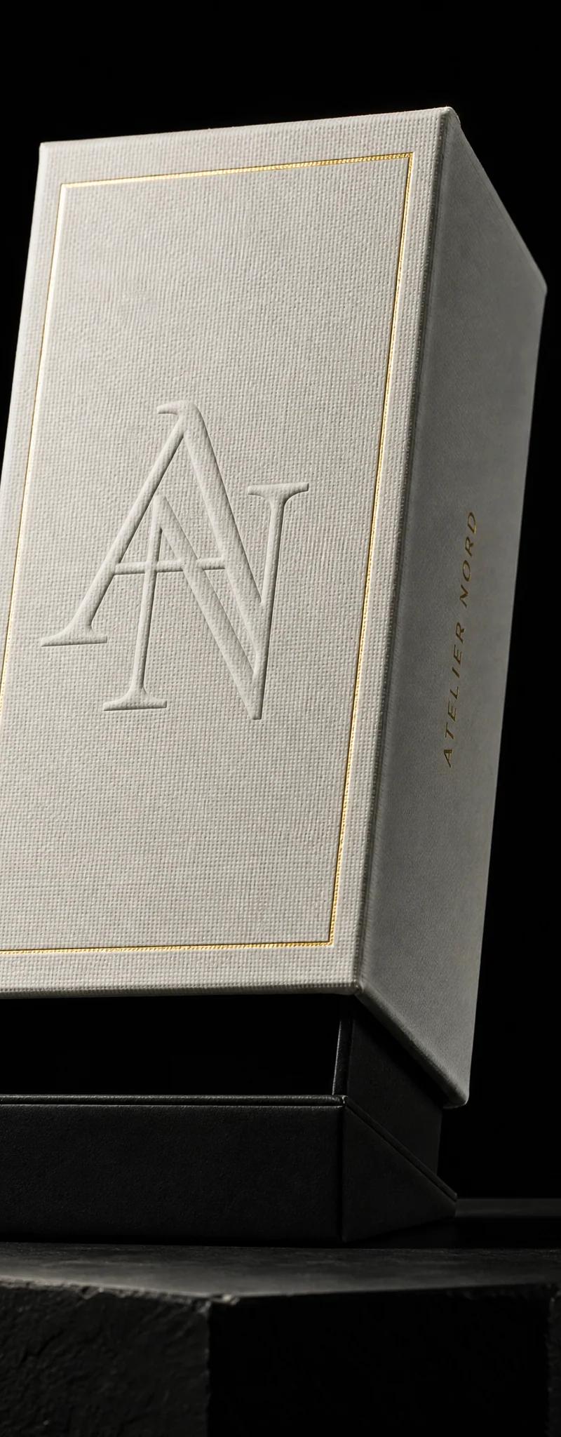 Business card with gold- foil stamping and blind-emboss.