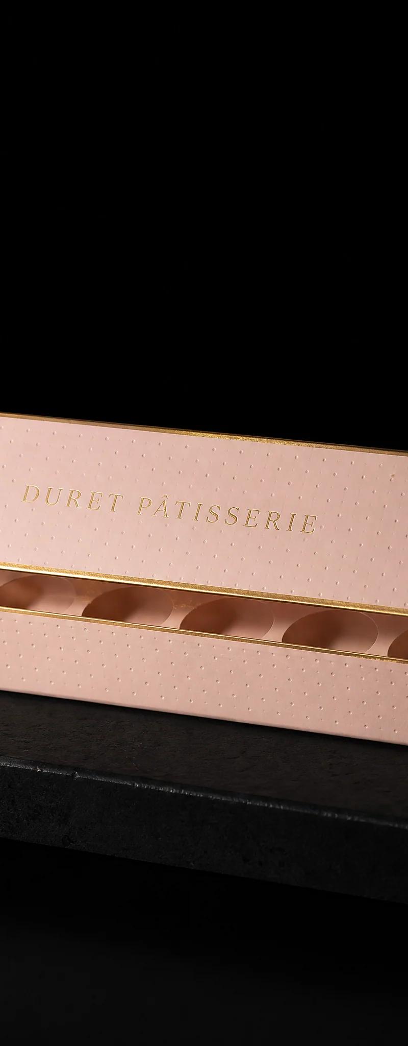 Business card with gold- foil stamping, deboss and soft-touch-laminate.