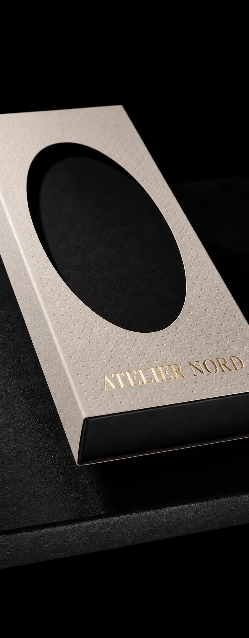 Business card with gold- foil stamping and die-cut.