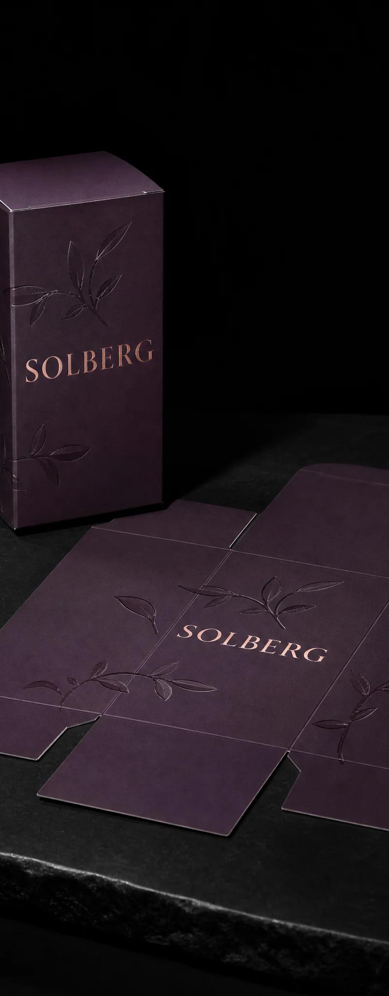 Business card with rose-gold- foil stamping and die-cut.