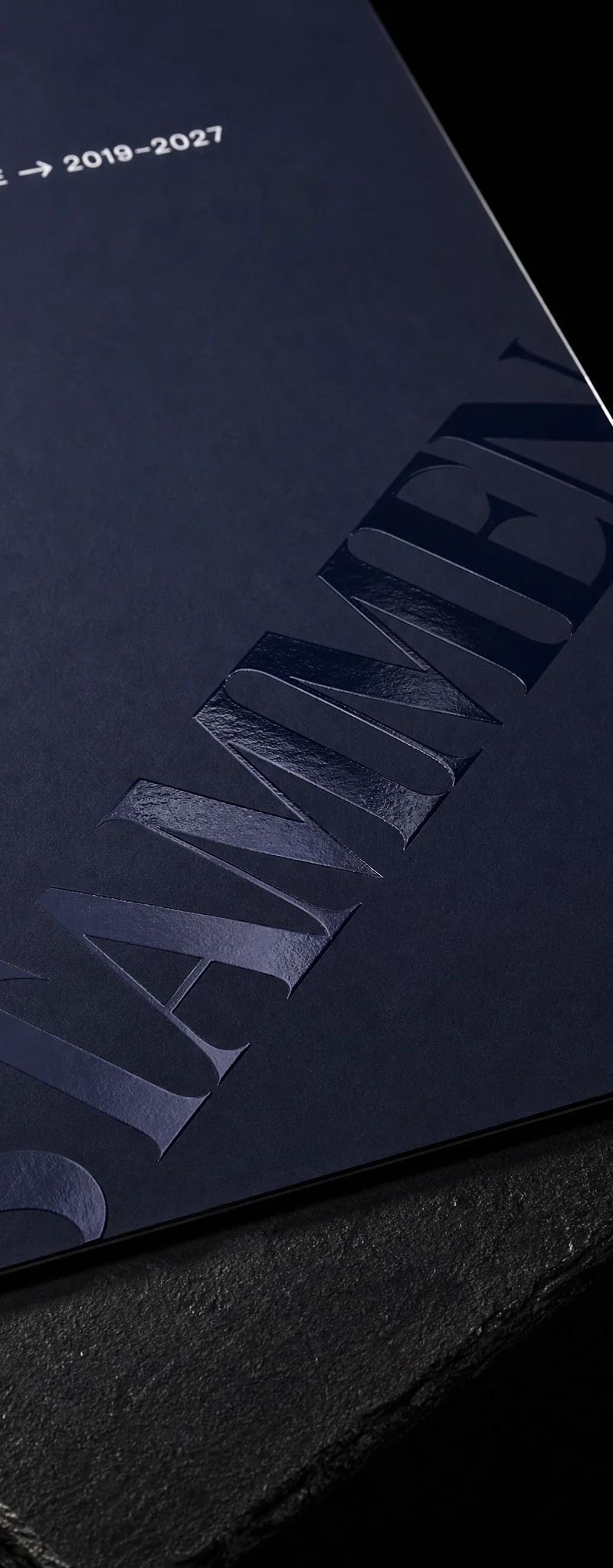 Business card with raised-spot-uv and soft-touch-laminate.