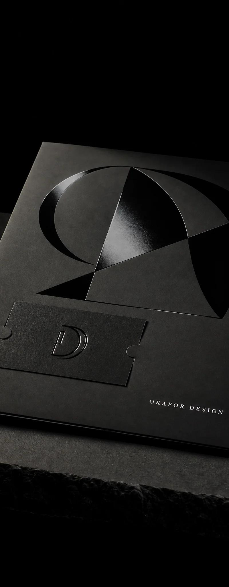 Business card with silver- foil stamping, raised-spot-uv and soft-touch-laminate.