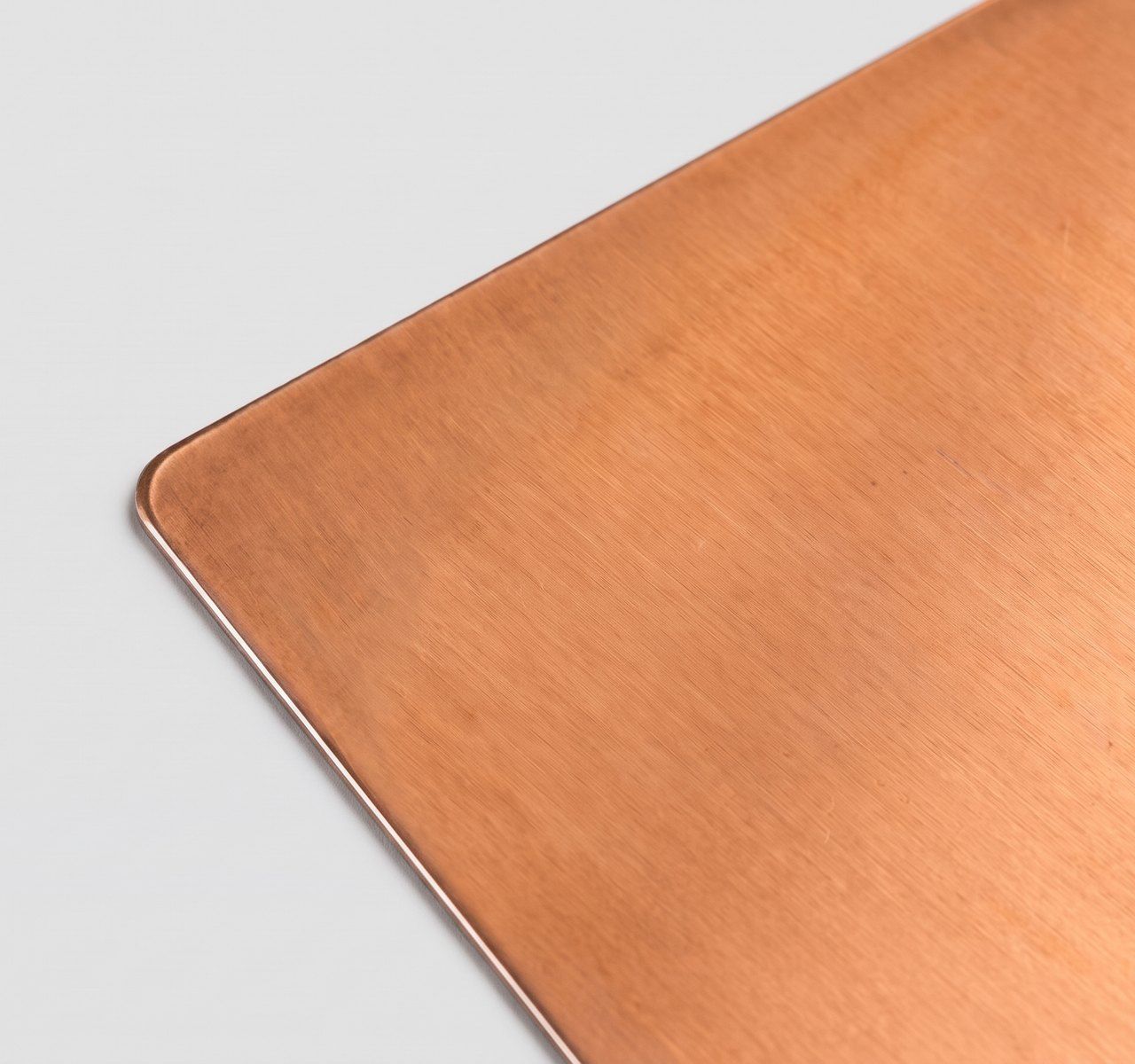 Copper metal, raw copper, warm orange-brown paper swatch